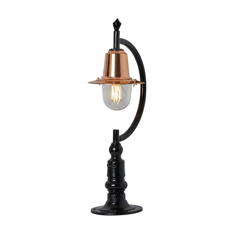 Small vintage pillar light for flat piers with a black gooseneck curve, copper teardrop shade, clear glass dome, and traditional cast base, shown on a white background.