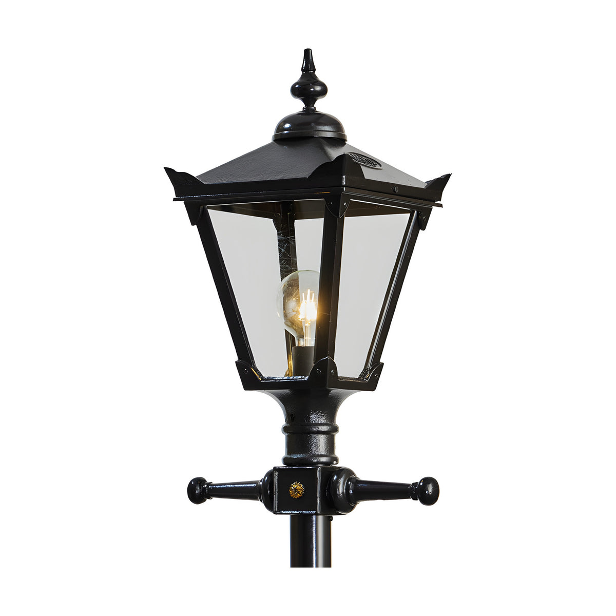 Victorian Manor cast iron lamp post in black, close-up of the lantern head with clear glass panels, decorative finial, and cross-arm bracket, shown against a plain white background.