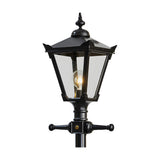 Victorian Manor cast iron lamp post in black, close-up of the lantern head with clear glass panels, decorative finial, and cross-arm bracket, shown against a plain white background.