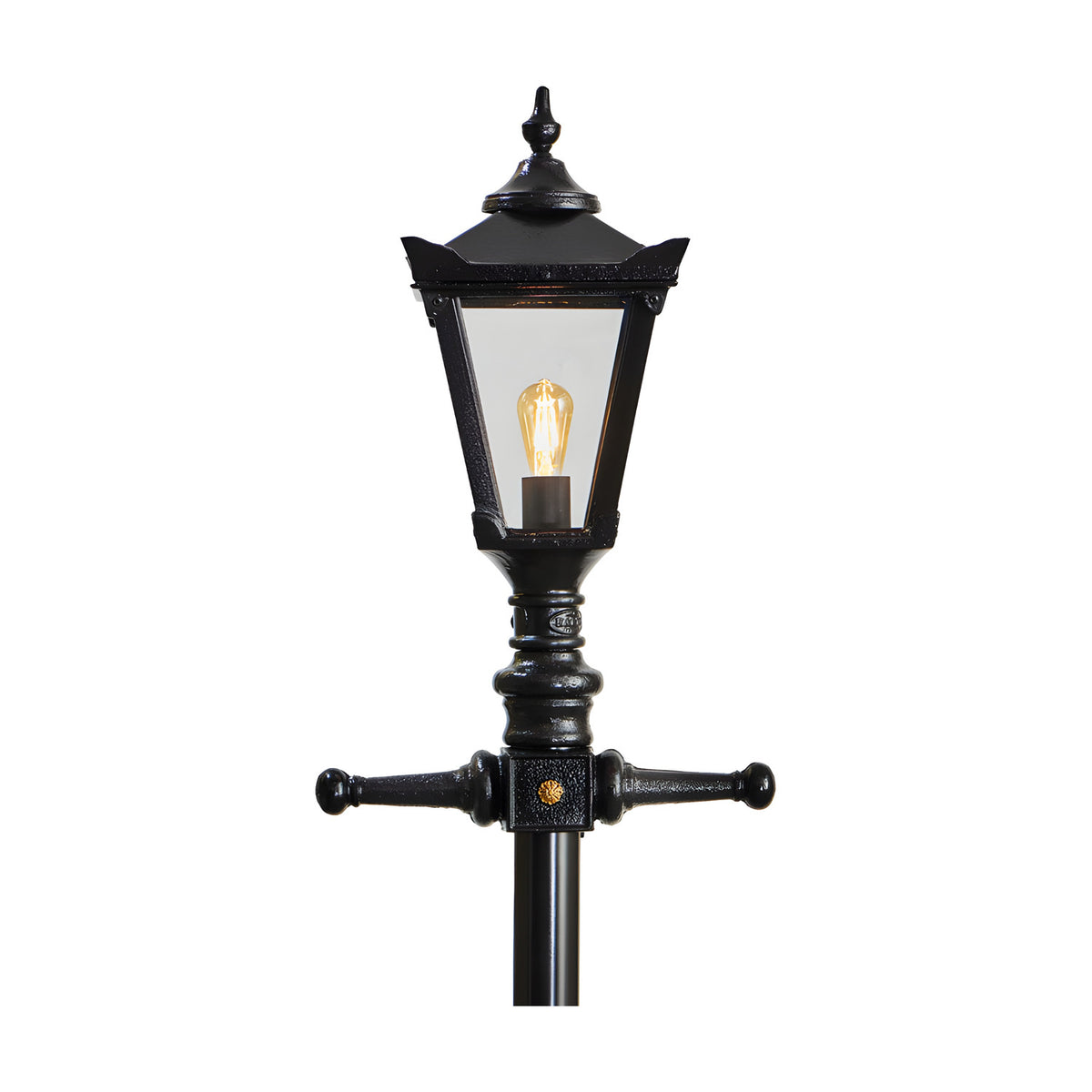 Victorian Manor cast iron lamp post in black with a lantern-style head, clear polycarbonate glazing, decorative finial, and cross-arm brackets on a slim column, shown against a plain white background.