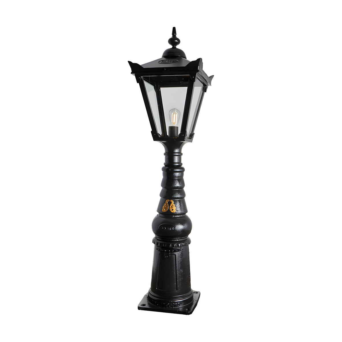 Large Victorian Manor cast iron pedestal post light in black, with a slim column base, hexagonal lantern head, clear glass panels and a single E27 bulb, shown on a plain white background.