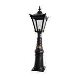 Large Victorian Manor cast iron pedestal post light in black, with a slim column base, hexagonal lantern head, clear glass panels and a single E27 bulb, shown on a plain white background.