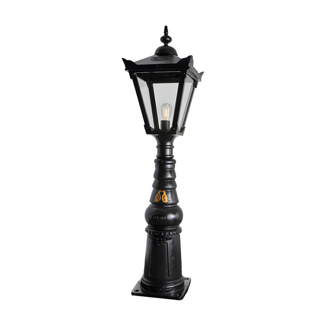 Large Victorian Manor cast iron pedestal post light in black, with a slim column base, hexagonal lantern head, clear glass panels and a single E27 bulb, shown on a plain white background.