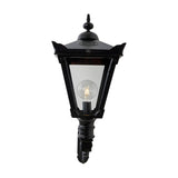 Victorian Manor black wall lantern with clear glass panels and an exposed bulb, mounted on a scroll bracket, shown against a plain white background.