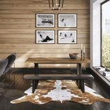 Hyde dining table with whiskey wood-effect top and black metal A-frame legs, shown with matching bench in a wood-panelled dining room.