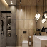 Modern bathroom with light wood-paneled walls, walk-in shower with matte black fixtures, built-in shelving, floating toilet, large mirror, minimalistic sink, and the Half Moon LED Pendant Light - Silver for energy-efficient minimalist lighting.