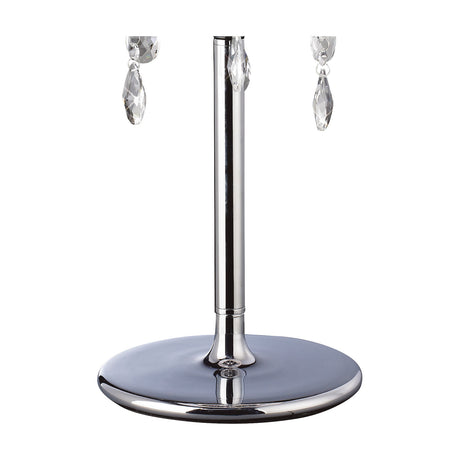Olivia 3 Light E14 Table Lamp base close-up, showing a polished chrome column on a round chrome foot with clear crystal drops above, set against a plain white background.