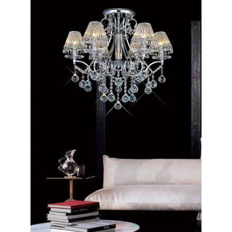 Bianco 6 Light E14 Chandelier 61cm in polished chrome with crystal drops and scalloped shades, shown above a light sofa and coffee table in a living room setting.