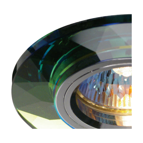 Close-up of a round crystal downlight rim with a bevelled, chamfered edge in Spectrum finish, showing multicoloured light reflections around the lamp housing.