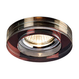 Crystal Round Downlight Rim in purple, 90mm face with 62mm cut-out, shown fitted around a lit GU10 lamp against a plain white background.