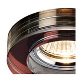 Close-up of the Crystal Round Downlight Rim in purple, 90mm face with 62mm cut-out, showing its deep faceted profile around a lit GU10 bulb.