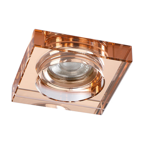 Square crystal downlight rim in rose gold with deep faceted edges and a round central bezel, 62mm cut-out, shown on a plain white background.