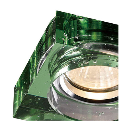 Close-up of the Crystal Square Downlight Rim in green, showing bubbled crystal detail around the chrome centre and lit bulb, on a white background.
