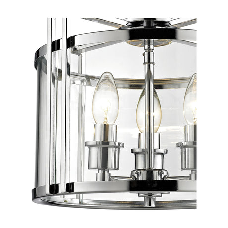Close-up of the Eaton 3 Light E14 Semi Flush Ceiling Light in polished chrome, showing candle bulbs held by chrome arms within a clear glass surround.