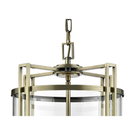 Close-up of the Eaton 4 Light E14 Pendant Light in antique brass, showing the chain, angular frame and clear glass panel detail against a plain white background.