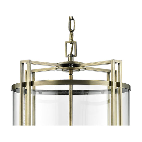 Eaton 6 Light E14 Pendant Light 42cm in antique brass, close-up of the geometric frame with clear glass shade and chain suspension against a white background.