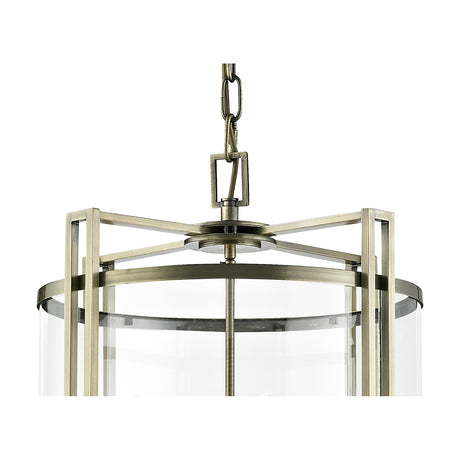 Close-up of the Eaton 12 Light E14 Pendant Light in antique brass, showing the metal frame, clear glass panel, and chain suspension against a white background.