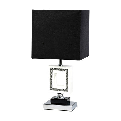 Linea E27 table lamp with a black square fabric shade above a rectangular crystal panel base in a polished chrome frame, set on a plain white background.