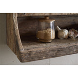 Ibo Reclaimed Wood Wall Shelf in natural finish, close-up of lower tier with raised front edge holding a lidded glass jar of sugar and garlic bulbs.