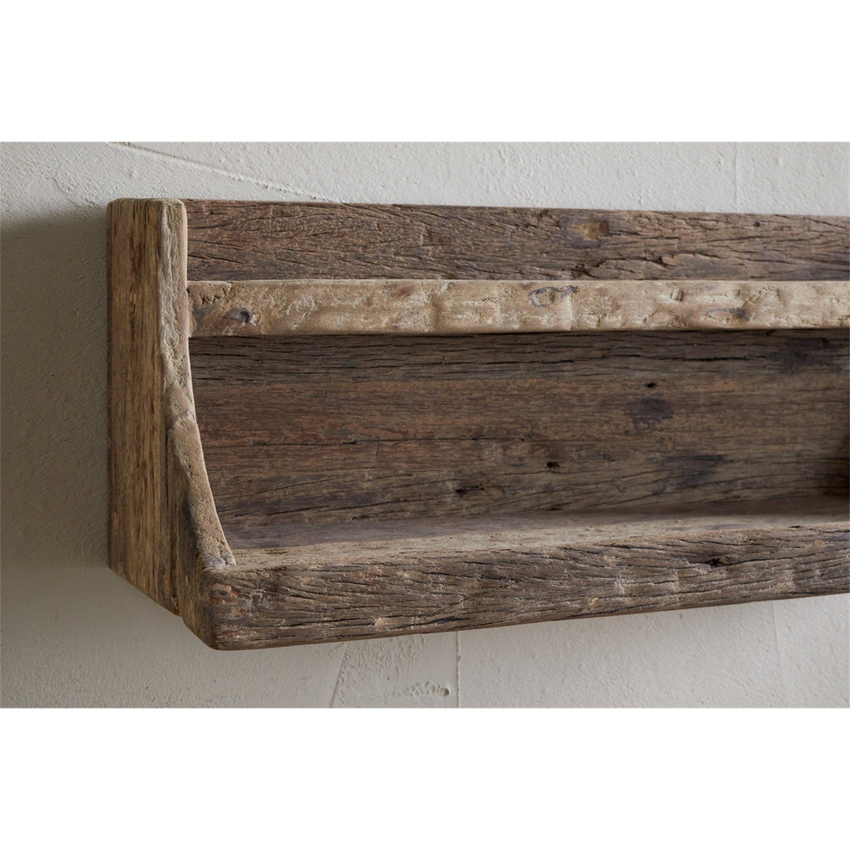 Ibo Reclaimed Wood Wall Shelf in natural finish, close-up of the two-tier design with raised front edge, pale front rail, and curved side supports, mounted on a plain wall.