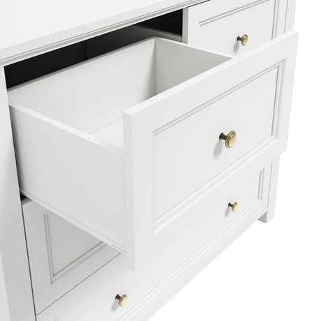 Ives Chest of Drawers in white with an open drawer showing panelled front, internal divider, and antique brass knob handles on a plain background.