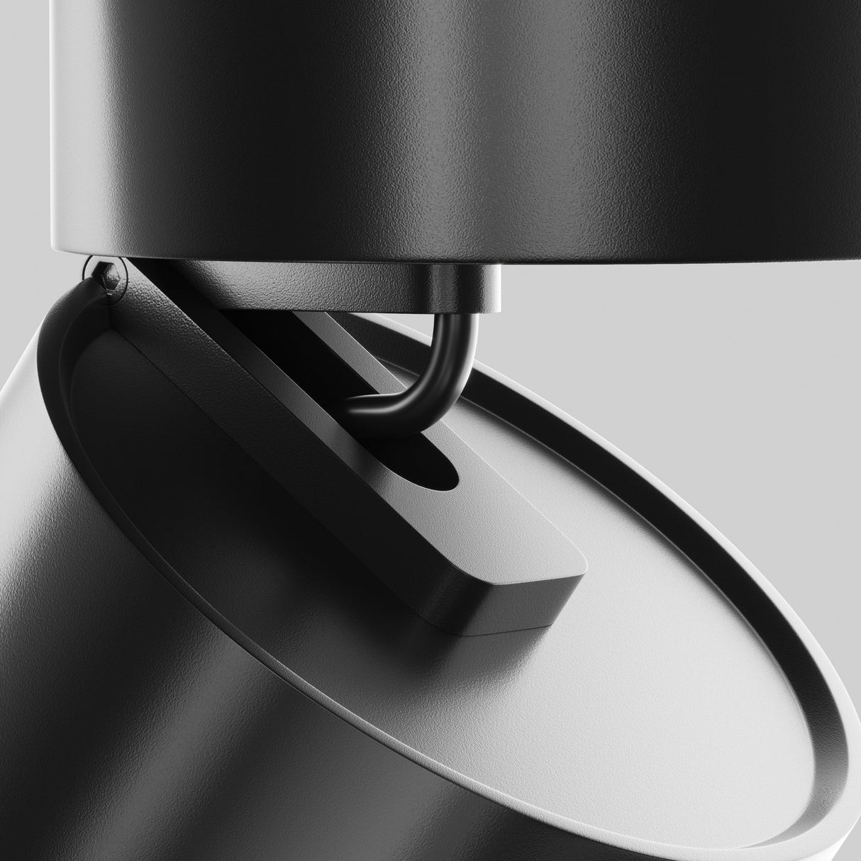 The Onda LED Single Spotlight, 12W 3000K in black, features a modern design with a sleek cylindrical shape and adjustable lighting through a pivoting joint. Its mounted on a stable base against a neutral gray background.