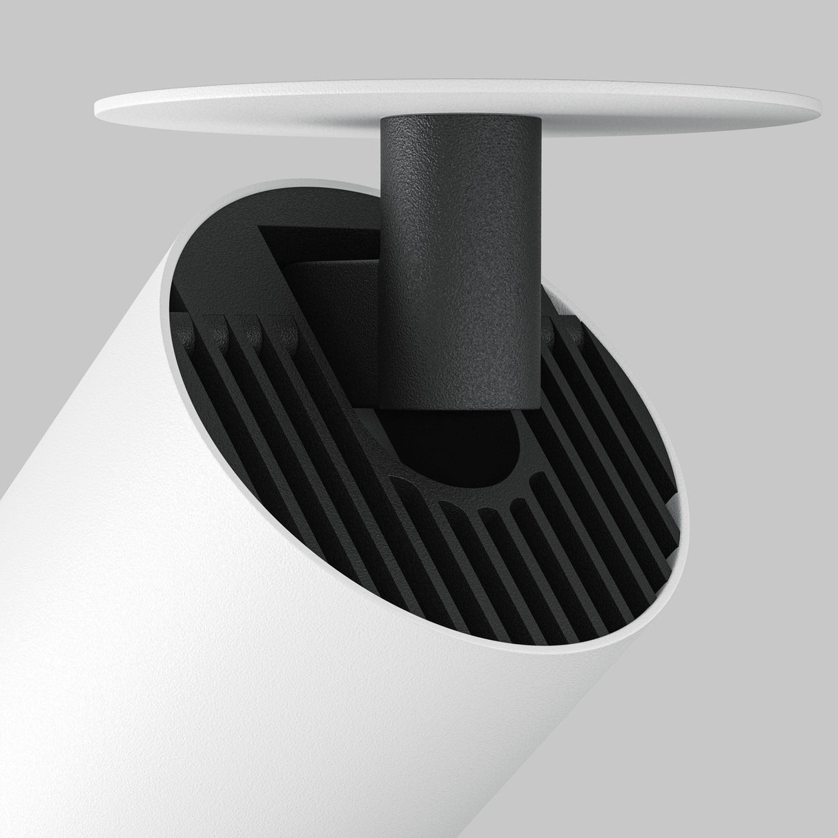 Close-up of the Focus LED Single Recessed Spotlight 12W 3000K - White, featuring a minimalist cylindrical design with a black internal structure. The fixture is mounted via a short black rod, providing energy-efficient lighting against a neutral gray background.