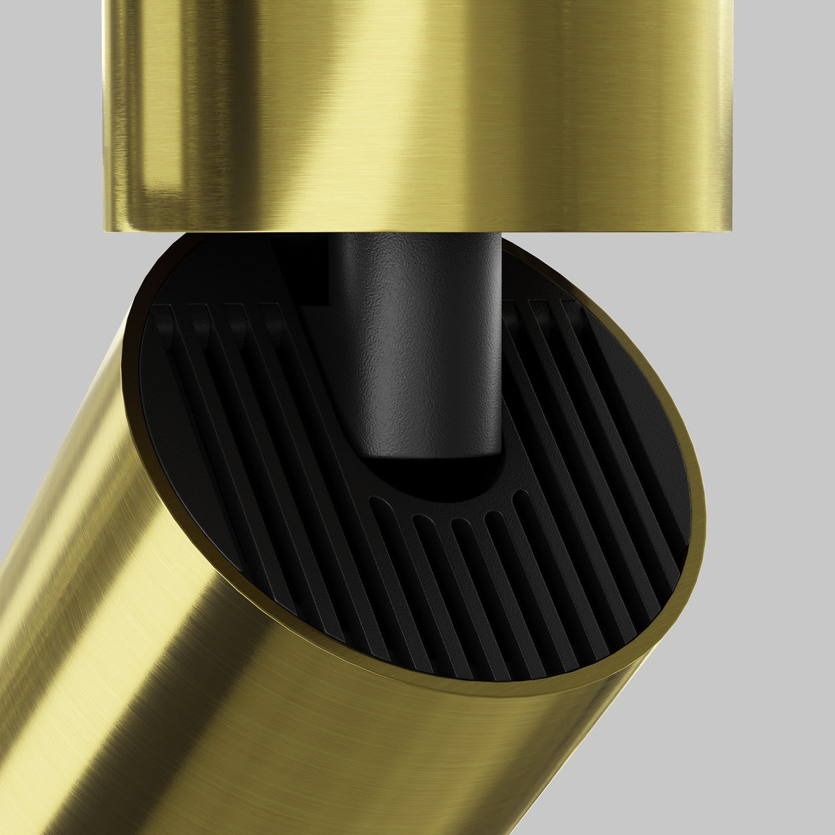 Close-up of a stylish, gold-colored cylindrical object with a black textured interior on a gray backdrop. The design resembles the Focus LED Single Surface-Mounted Spotlight 12W 3000K - Brass, offering minimalistic and energy-efficient lighting.