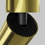 Close-up of a stylish, gold-colored cylindrical object with a black textured interior on a gray backdrop. The design resembles the Focus LED Single Surface-Mounted Spotlight 12W 3000K - Brass, offering minimalistic and energy-efficient lighting.