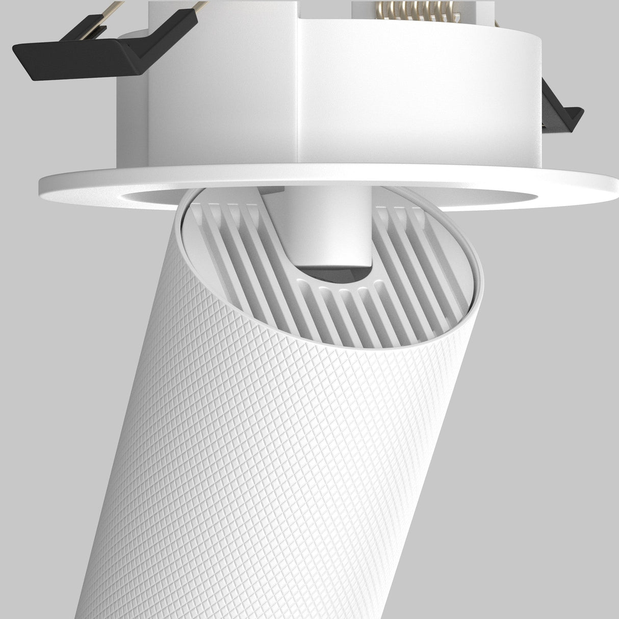 Close-up of the Artisan Single Tilt Round Recessed Downlight in white, featuring a textured cylindrical body and adjustable tilt. The aluminum fixture is mounted on the ceiling, showcasing its modern design and functionality.