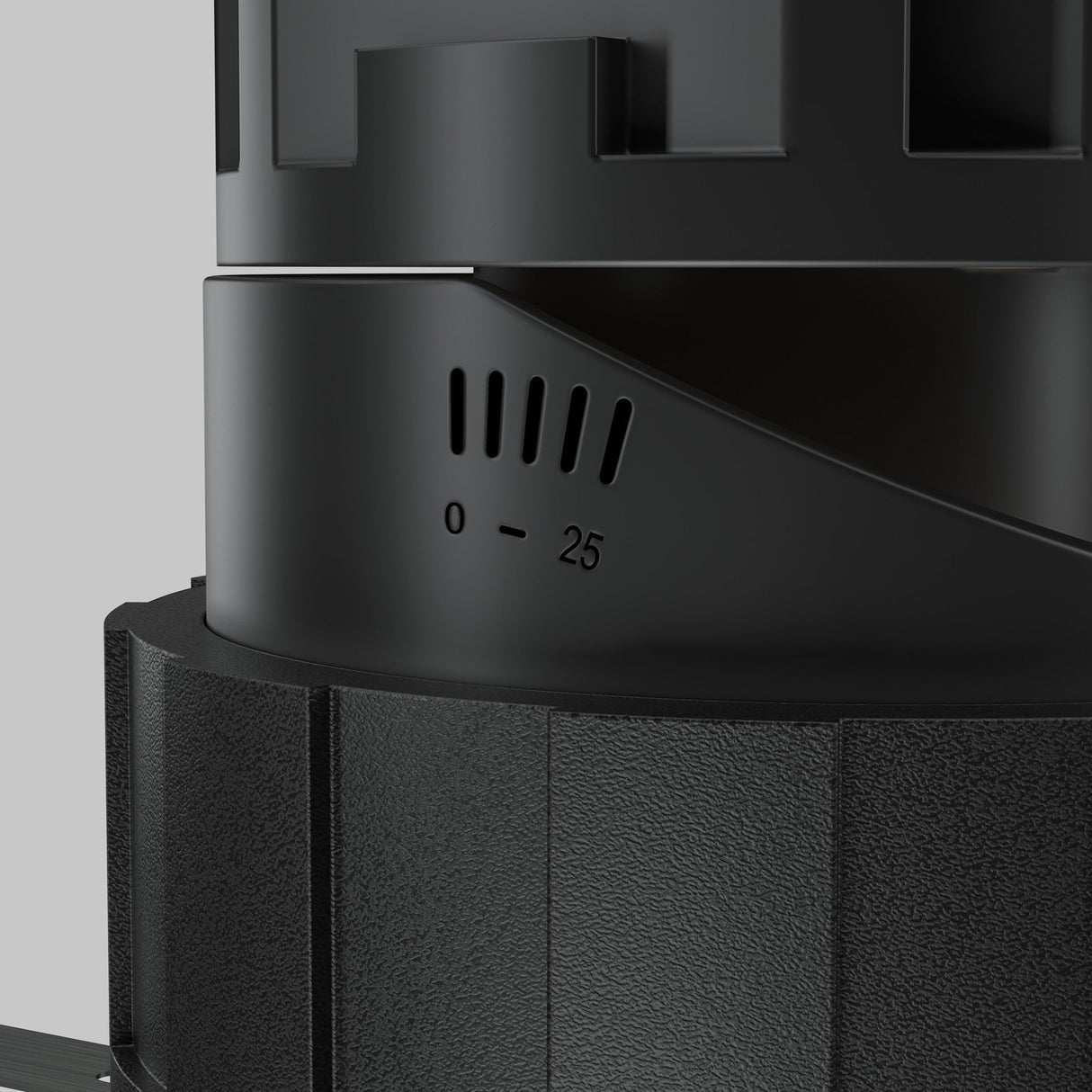 Close-up shot of the Wise LED Round Recessed Downlight 10W 3000K in black, featuring a minimalist cylindrical design with a matte texture and grooves. The scale labeled 0 to 25 accentuates its details against a blurred background.