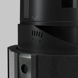 Close-up of a black Wise LED Round Recessed Downlight 7W 3000K, featuring a numbered dial (0-25), textured surface, and metallic accents. A downward arrow is above the dial on a plain gray background.