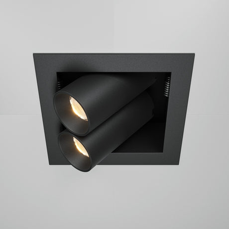 The Magnum LED Recessed Twin Adjustable Downlight 14W 3000K in black features two cylindrical LED spotlights on a square black plate. These energy-efficient, adjustable lights cast a warm glow against the white ceiling.