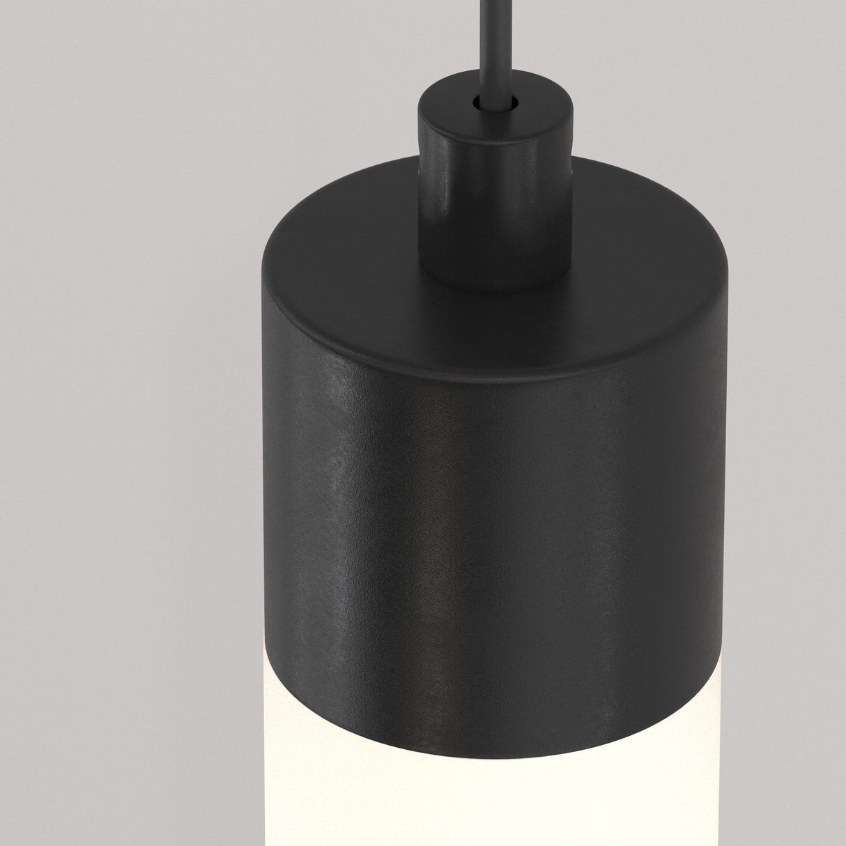 The Ray LED Long Pendant Light features a matte black top, white frosted glass bottom, suspended by a black cord against a light gray background, making it an energy-efficient choice for minimalist interiors.