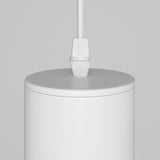 The Focus Single Pendant Light - White features a sleek, white cylindrical design that hangs elegantly from a matching cord against a light gray background, ideal for contemporary interiors and enhancing its minimalist charm.