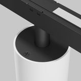 Close-up of the Alfa S LED Magnetic Exility Track Downlight 7W 3000K in white, with a minimalist base and horizontal arm. A screw is visible on top against the plain light gray background, providing energy-saving warm 3000K illumination.