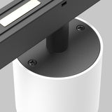 Close-up of the Alfa S CCT LED Dimmable Magnetic Exility Track Downlight 7W 2700-6000K - White, showcasing an adjustable color temperature. A cylindrical white base and black top support a rectangular LED on a black bar with two visible screws, set against a gray background enhancing its sleek design.