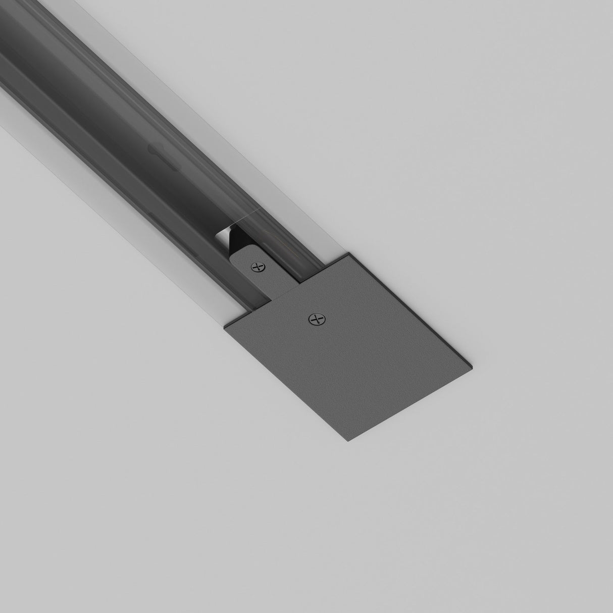 A close-up of the Unity Tracks Power Feed - Black reveals its sleek design with durable plastic and aluminum. Visible screws and a sliding mechanism contrast with the smooth light gray ceiling, enhancing its modern, minimalistic appeal.