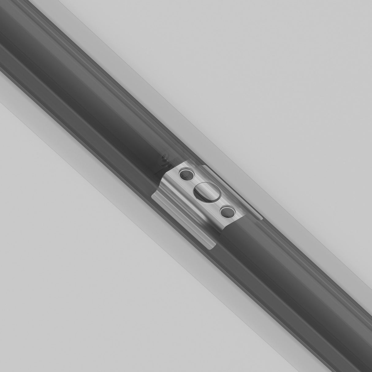 A close-up of the Single Phase Unity Tracks Built-in Spring Holder - Silver, showcasing its sleek metallic slide mechanism with a rectangular component, perfect for track lighting. It includes a central circular socket and two smaller holes, set against a gray background.