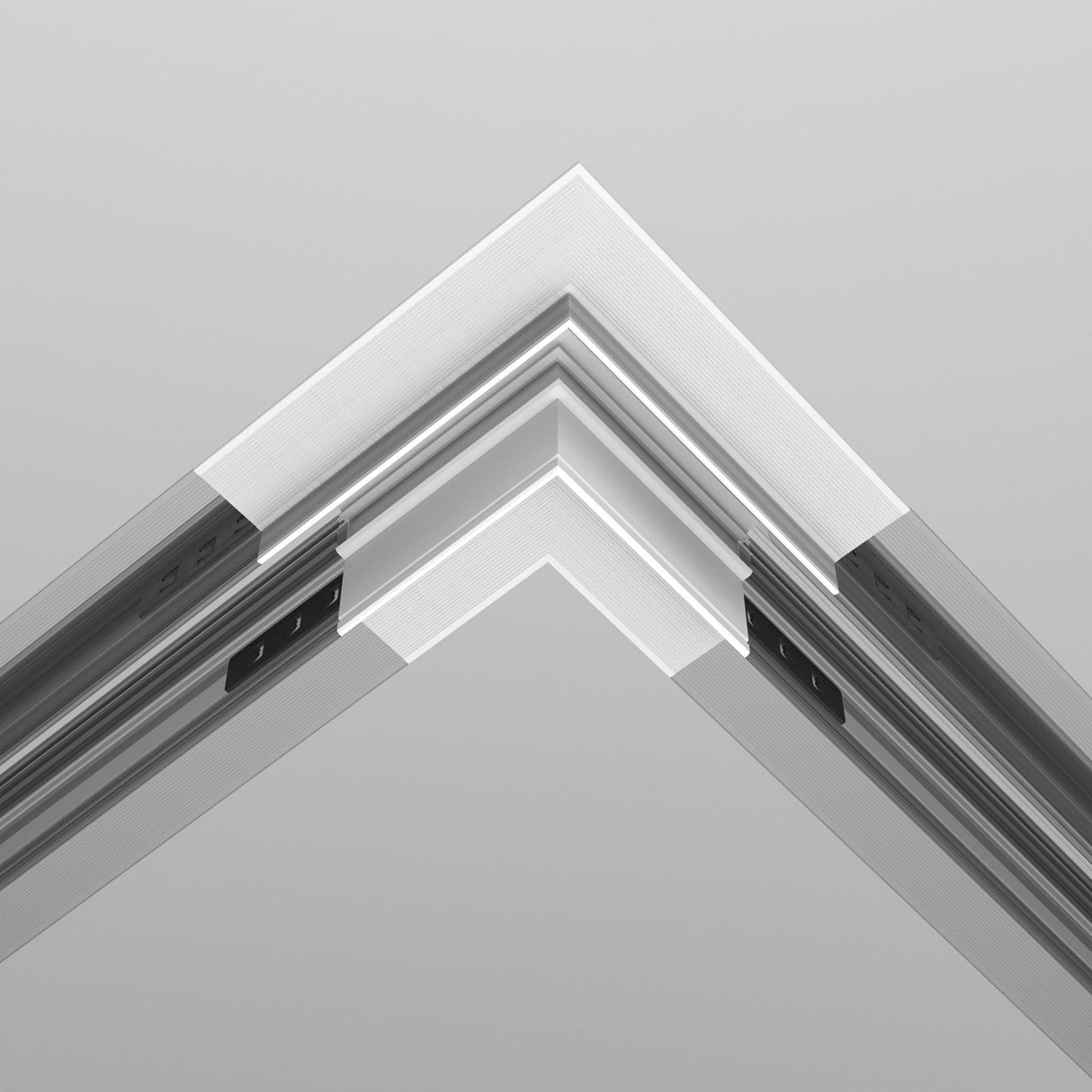 Close-up of an Exility Tracks L-Shape Corner Connector for Plasterboard 12.5mm, showcasing sleek architectural lines and edges in white. The geometric structure enhances a minimalist aesthetic and contemporary design against a light backdrop.
