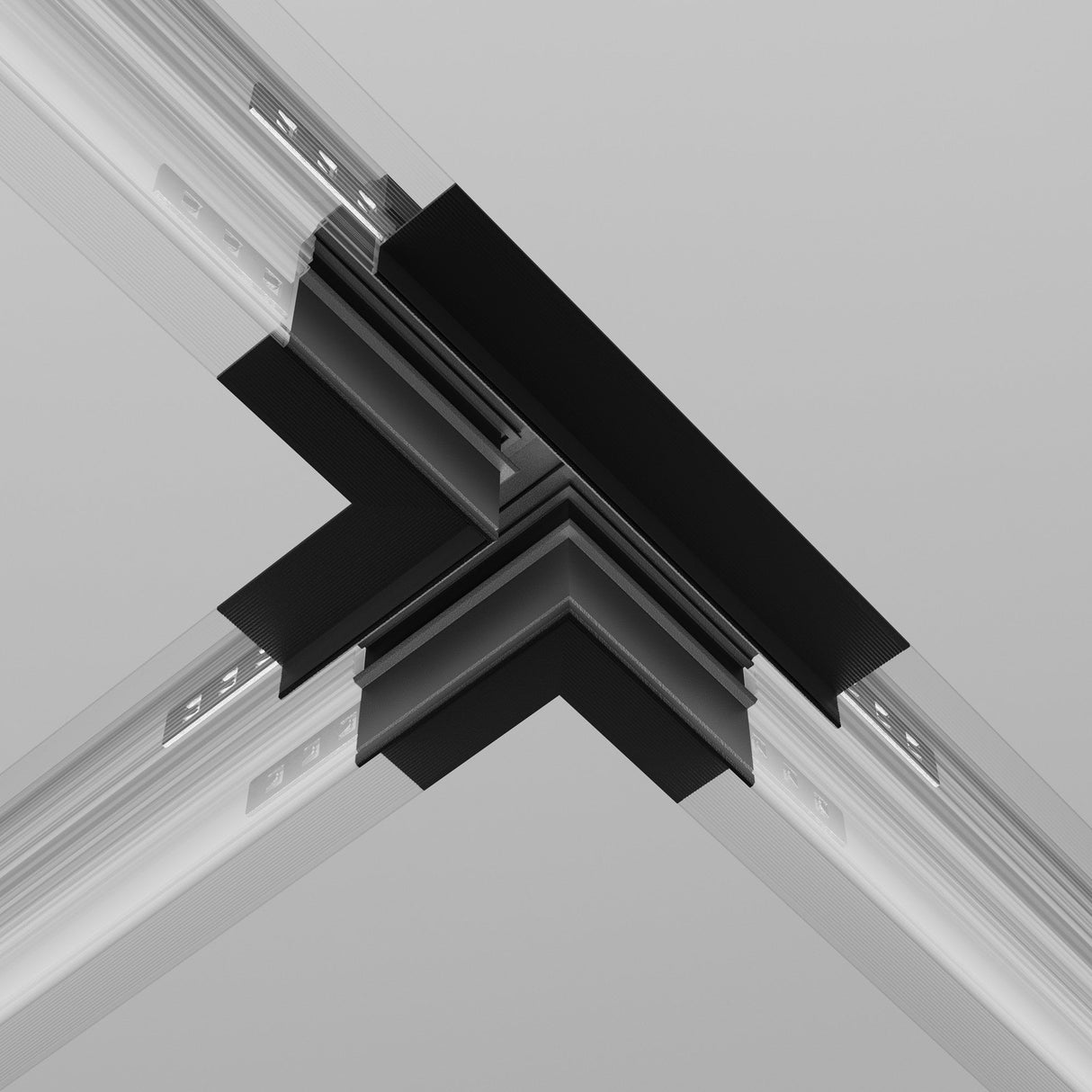 Close-up of the Exility Tracks T-Connector Built-in For Plasterboard 12.5mm - Black, linking four transparent beams at right angles against a light gray background, reminiscent of a modern recessed track system.