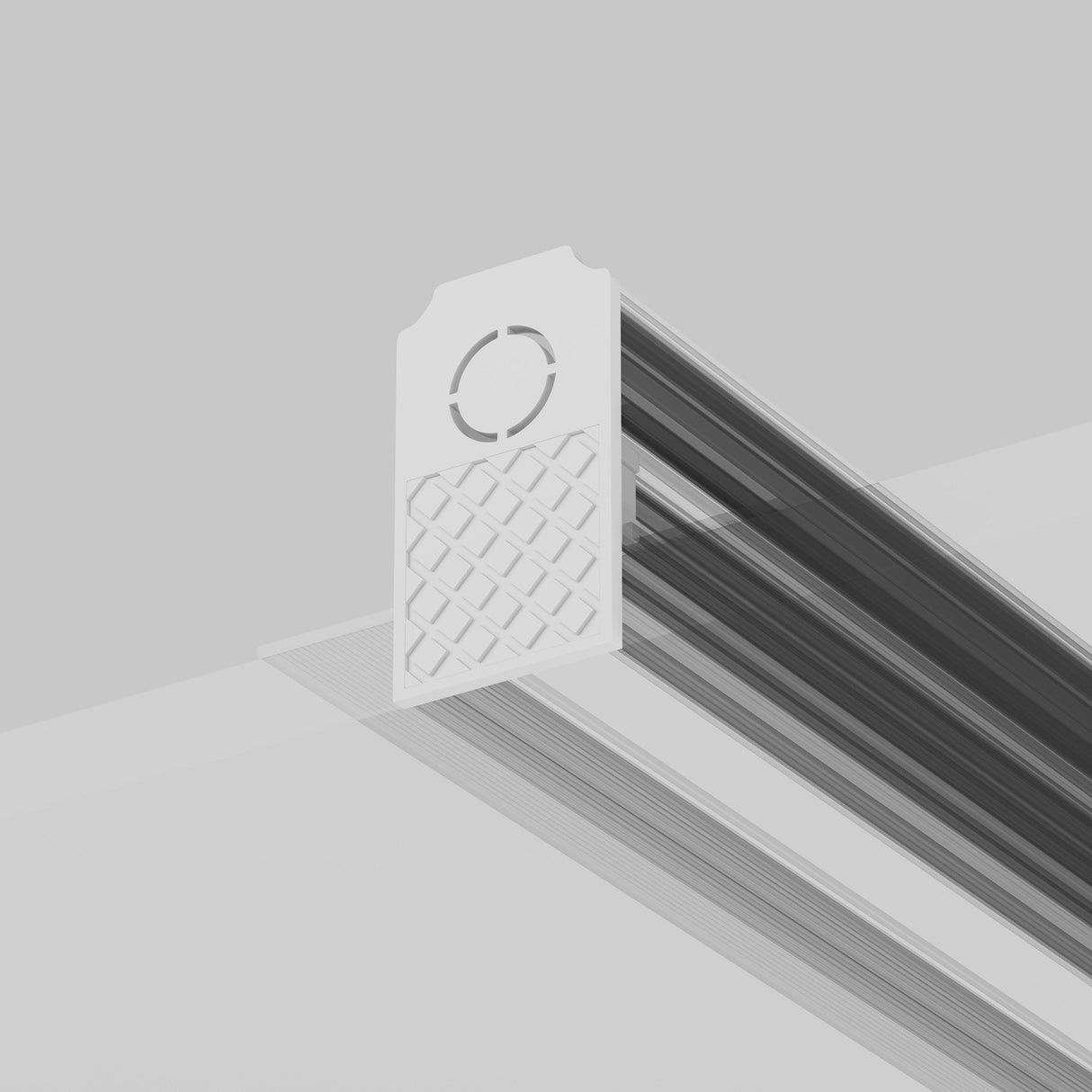 A white, rectangular Exility End Cap with a grid pattern and circular cutout slides onto a narrow, dark magnetic track, likely attaching to ceilings or walls to enhance spaces with sleek design and functionality.