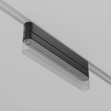 The Radity Magnetic Track Long Adaptor - Black is a modern, rectangular ceiling-mounted light fixture with durable construction, featuring a black housing and translucent cover. Its mounted on a magnetic track for seamless connectivity, blending effortlessly into the ceiling.