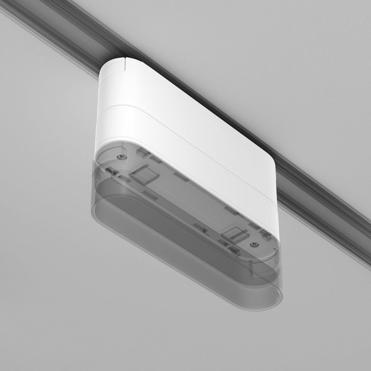 The Radity Magnetic Track Short Adaptor in white features a minimalist rectangular design with visible internal components and screws, perfect for modern interiors when mounted on a ceiling track, elegantly complementing a light gray background.