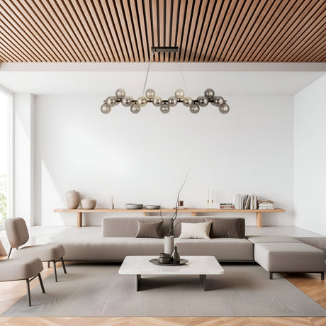 A modern living room featuring a geometrically designed chandelier, Dallas 25 Light Linear Suspension in black with smoked glass. It includes white walls, a wooden slatted ceiling, a large grey sectional sofa, a low marble coffee table, minimalist decor, and a big window enhancing the lighting.