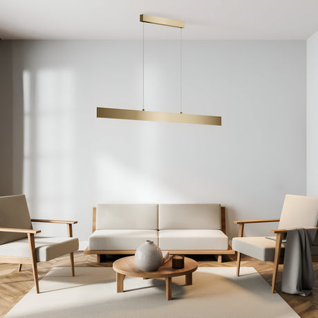 A minimalist living room has a cream sofa, two armchairs, and a round wooden coffee table with a vase. The Step LED Long Linear Suspension Light 4000K 30W - Gold hangs elegantly from the ceiling, complementing the light wood floor and white walls.
