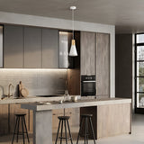A modern kitchen with a large island and three stools embodies Scandinavian design. Gray cabinets and tiled backsplashes are accented by wooden paneling, while the Bicones Pendant Light enhances ambiance. A stainless steel sink, built-in oven, and window provide functionality and light.