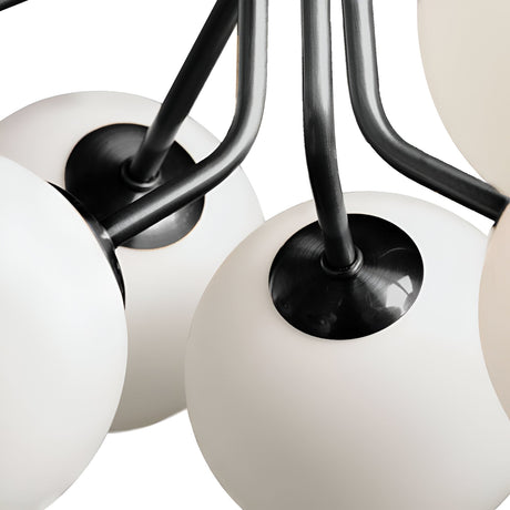 Close-up of the Ivy 9 Light Chandelier - Black, showcasing opal glass shades and sleek black metal arms against a white background.