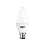The JCB 5.5W Non-Dimmable LED Candle Bulb, available in a warm white 3000K tone and compatible with a B22 base, features a candle shape and a glossy finish. It's designed for energy-efficient lighting and prominently displays the JCB logo.