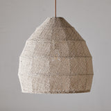 Jahari Woven Jute Pendant Light in natural tones, showing a large open-weave dome with visible seam panels and a rust-coloured cord, against a plain grey background.